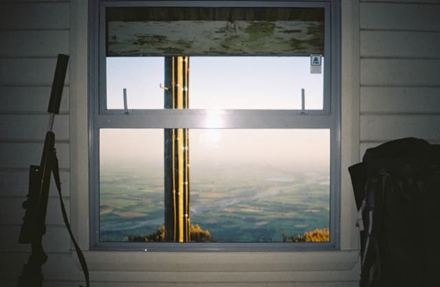 Window View Landscape Rifle Jacket Wall White Blue Sky Sunlight Reflection Frame Glass Horizon