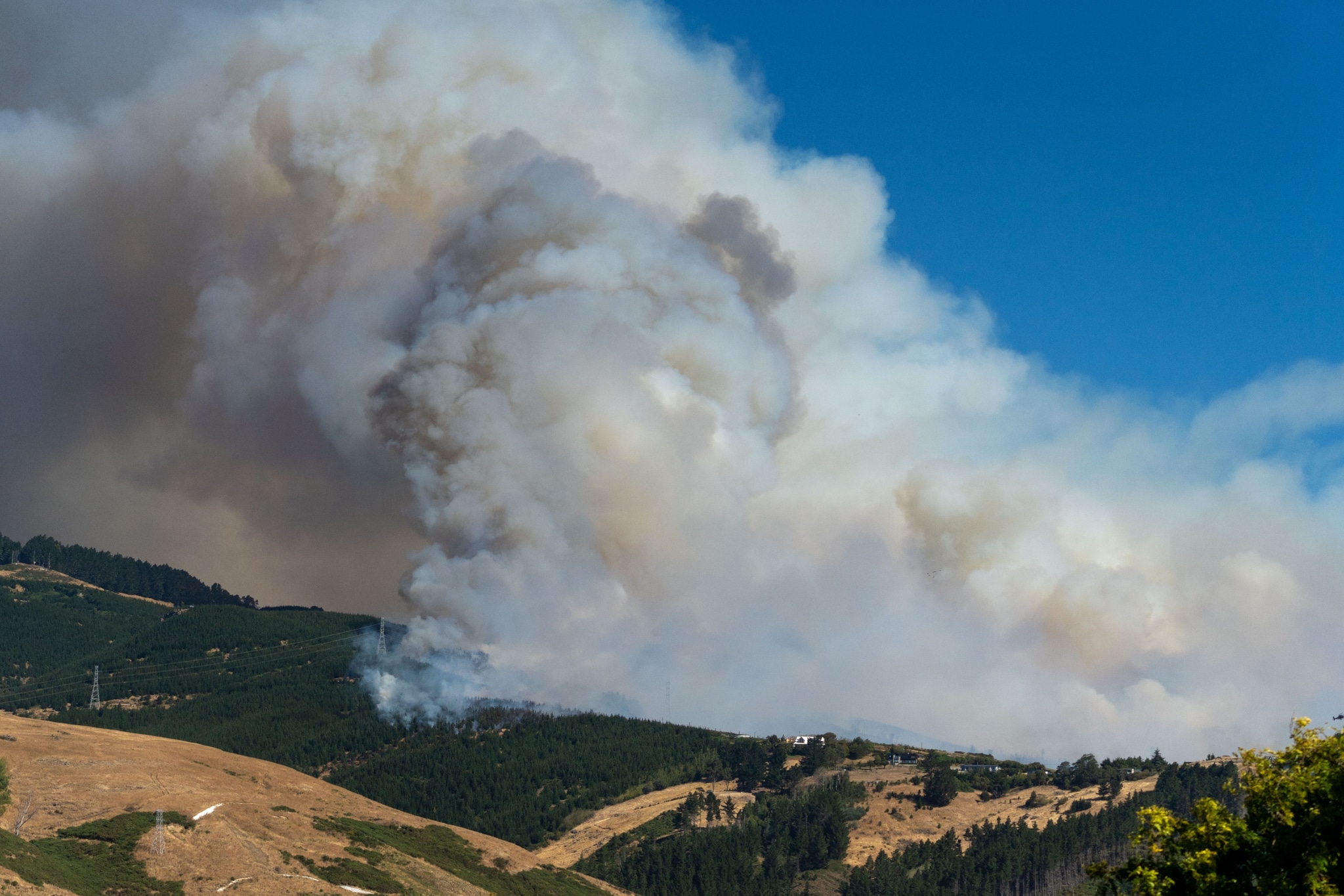 Smoke Fire Hill Forest Sky Blue Cloud Landscape Nature Outdoors Scenery Vegetation Trees Mountain Wildfire Environment Natural Disaster Emergency Burning Heat Summer Scorched Earth Crisis Hazardous Air Pollution Climate Change Drought Dry Weather