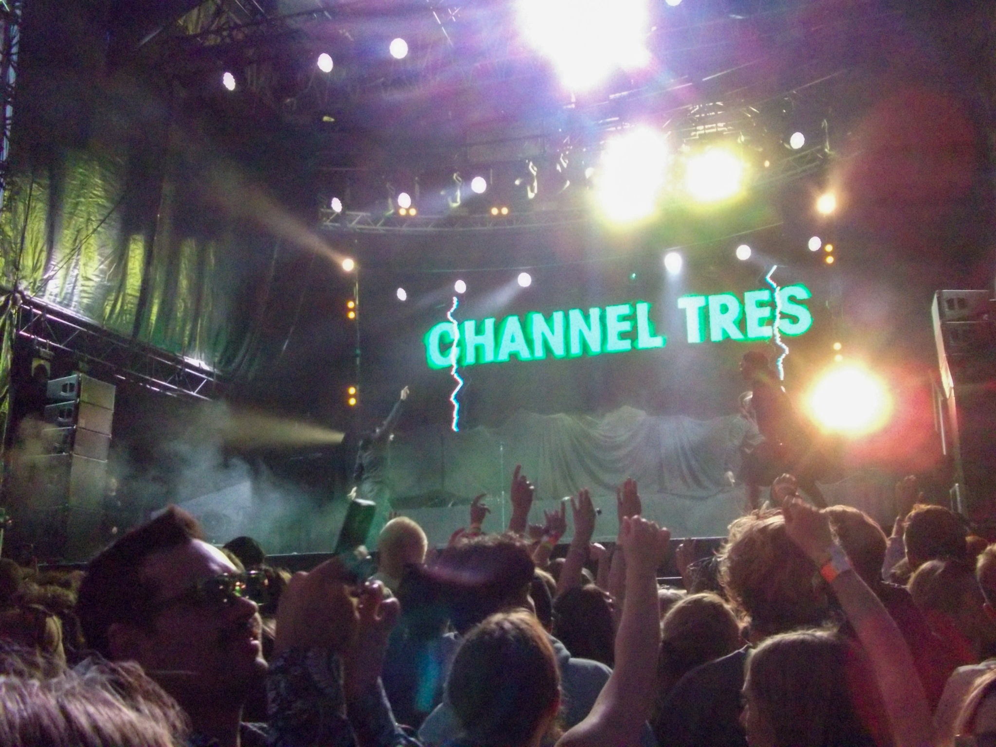 concert stage crowd lights performance audience music event night green screen text people atmosphere energy excitement entertainment festival live show dark