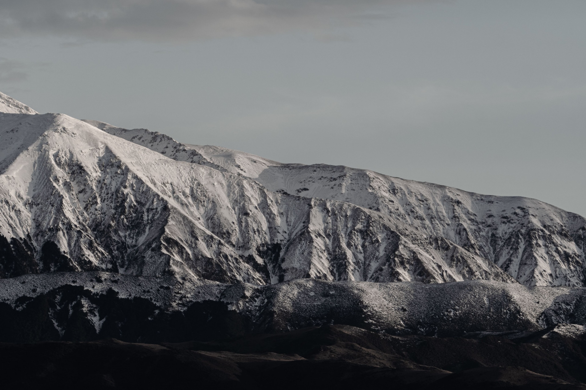 Mountain Snow Peaks Landscape Nature Sky Clouds Winter Cold Rugged Scenery Outdoors Wilderness Ice Summit Ridge Horizon Majestic Remote Serene Tranquil Crisp Pristine Untouched Vast Expansive White Gray Rocky Alpine